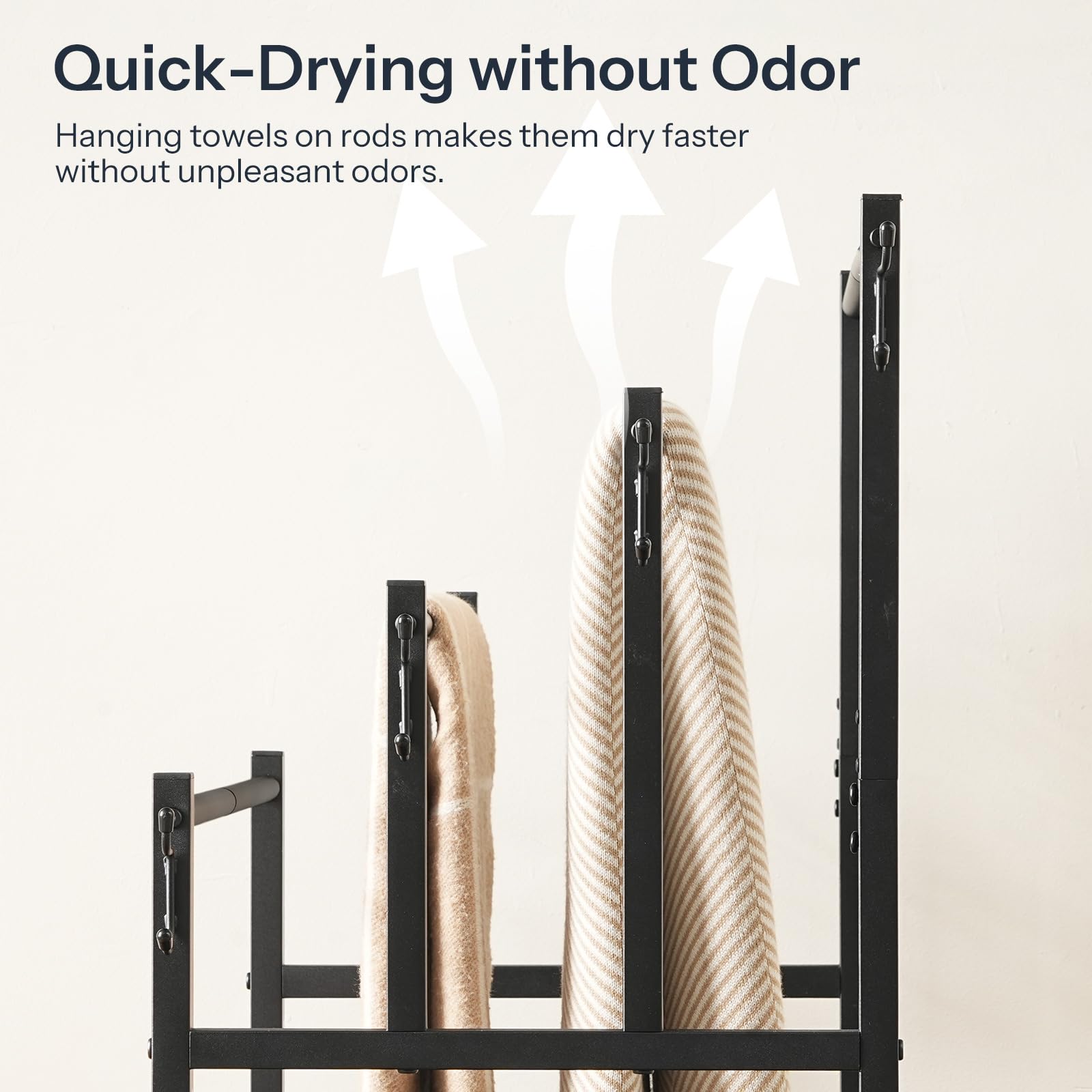 Towel rack with towels hanging on it, text about quick-drying without odor.