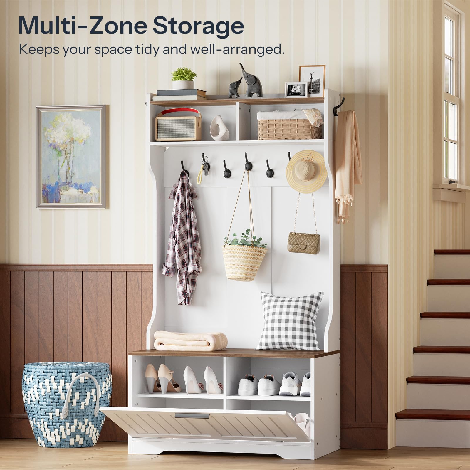 White multi-zone storage unit with shelves, hooks, and shoe storage in a home setting.