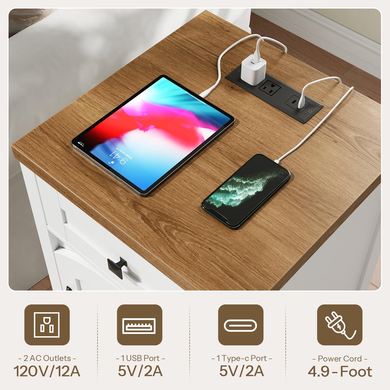 Wooden desk with electronic devices and power outlets, including a tablet and smartphone.