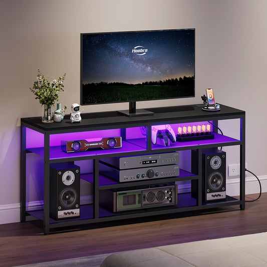 Black entertainment console with purple LED lighting displaying electronic devices.