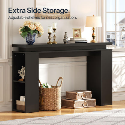 Black console table with storage shelves in a living room setting.