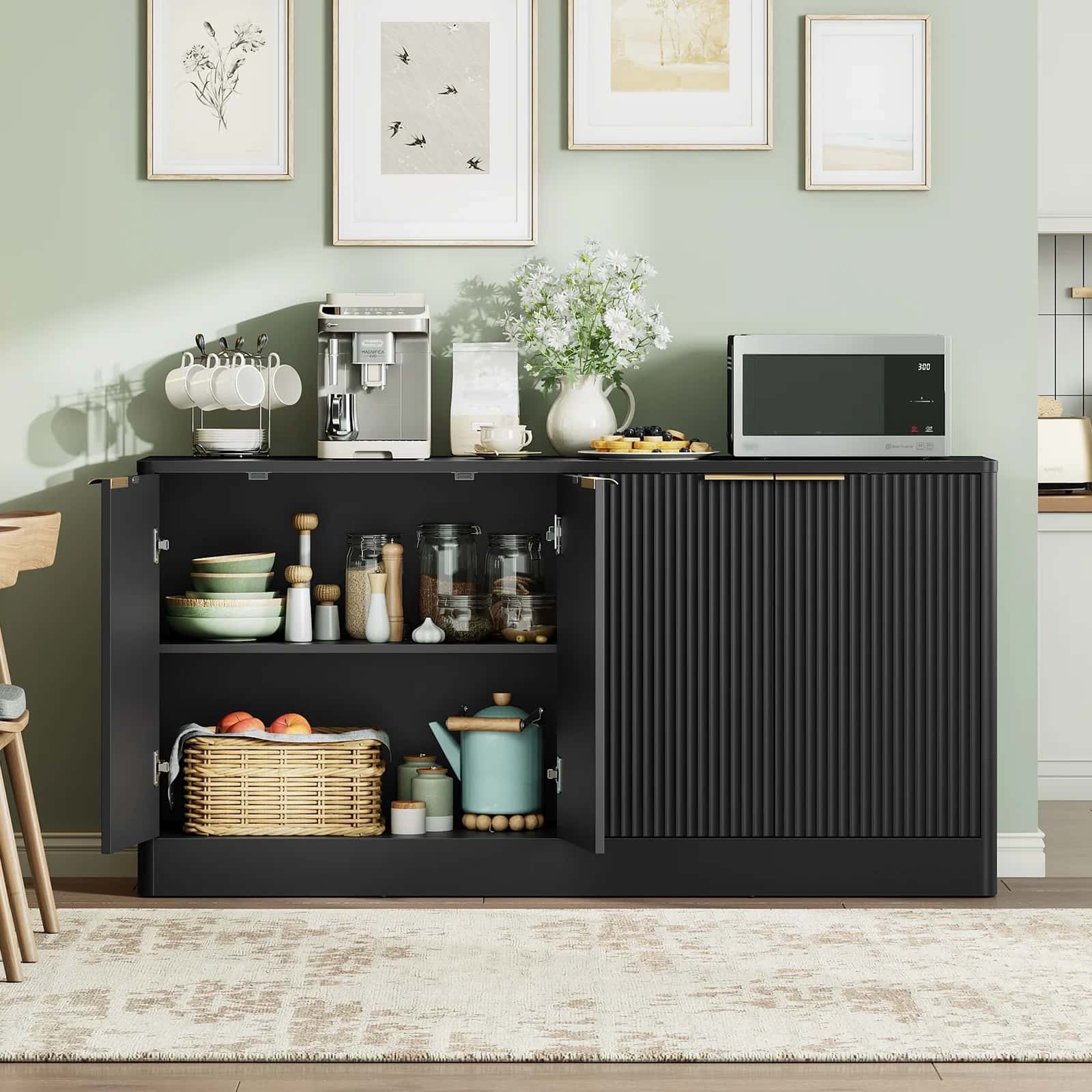Black kitchen cabinet with various items against a light green wall.