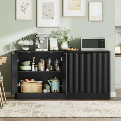 Black kitchen cabinet with various items against a light green wall.