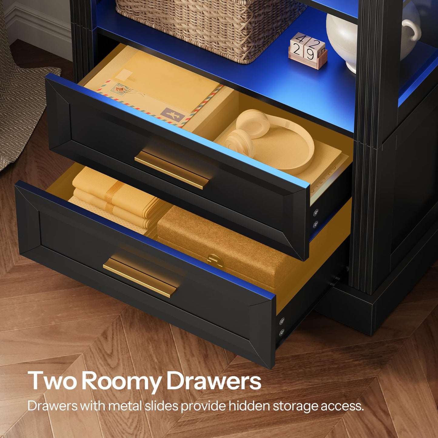 Black nightstand with open drawers on a wooden floor, featuring text about roomy drawers.
