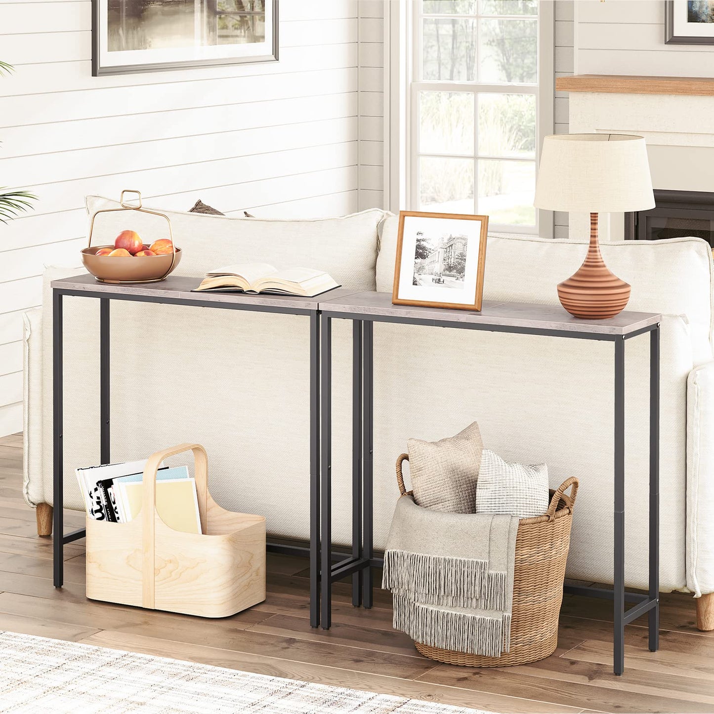 Console table in a living room with decor items on top