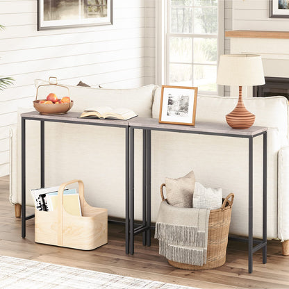 Console table in a living room with decor items on top