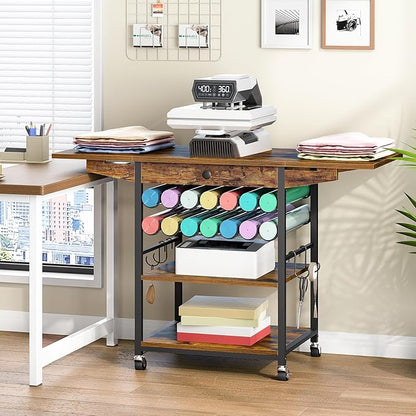 Wooden craft table with rolling cart, supplies, and printer in a home office setting.