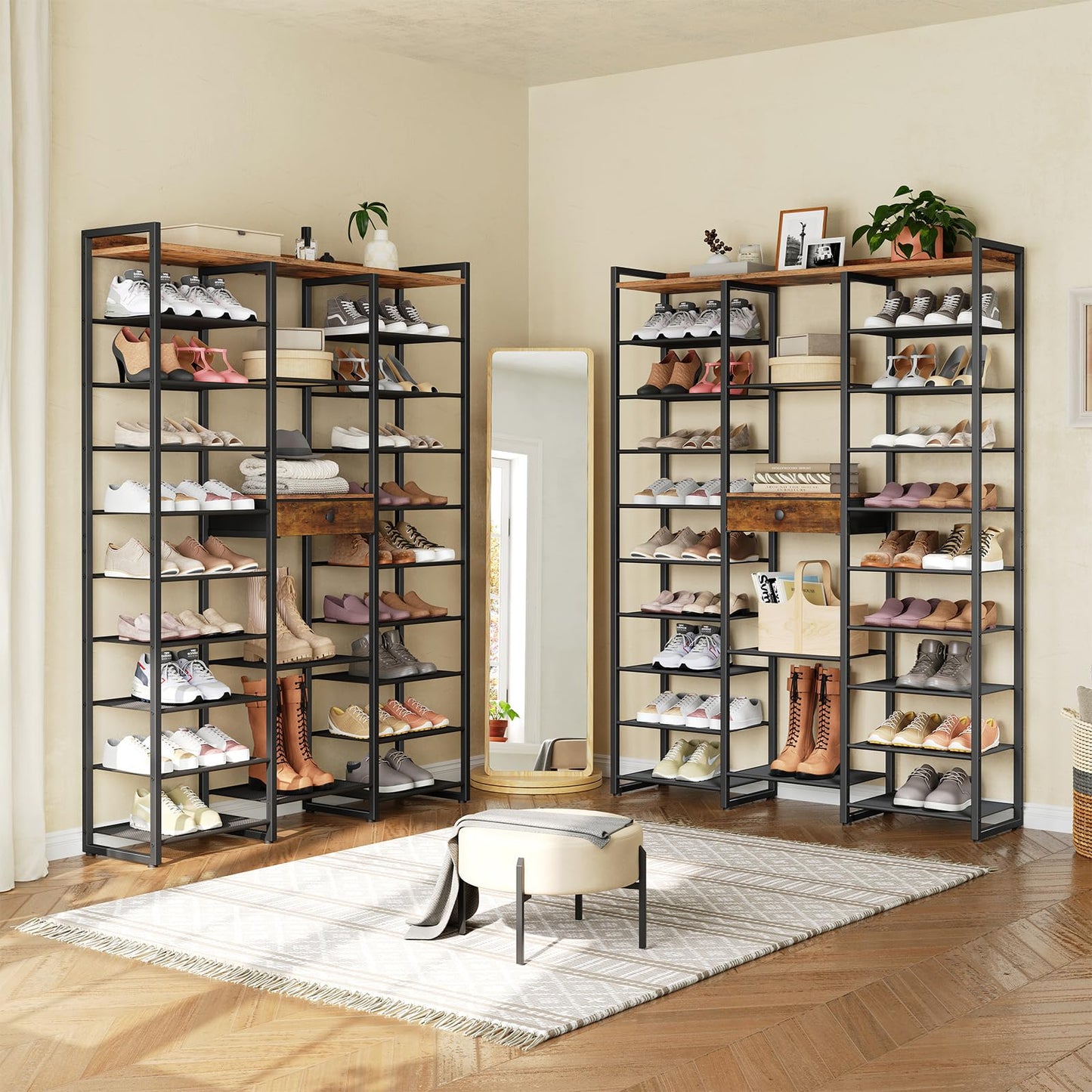 Two large shoe shelves filled with shoes in a room with a mirror and rug.