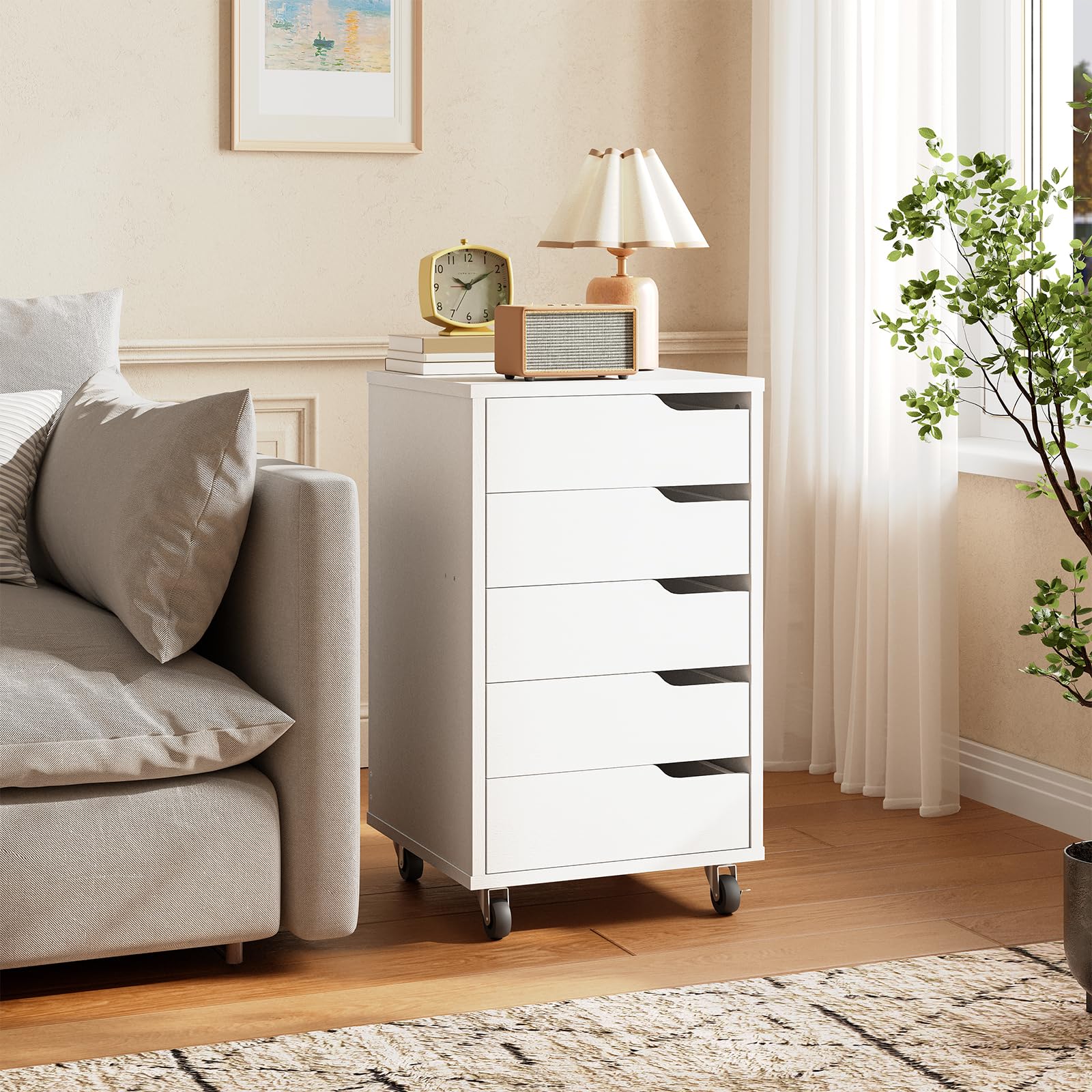 White dresser with decorative items in a living room setting