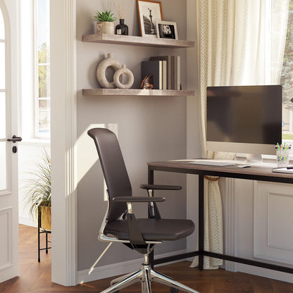 Home office with a desk, chair, and shelves with decorative items.
