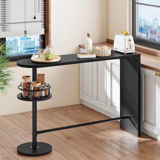 Black kitchen island with a toaster and other items in a modern kitchen.