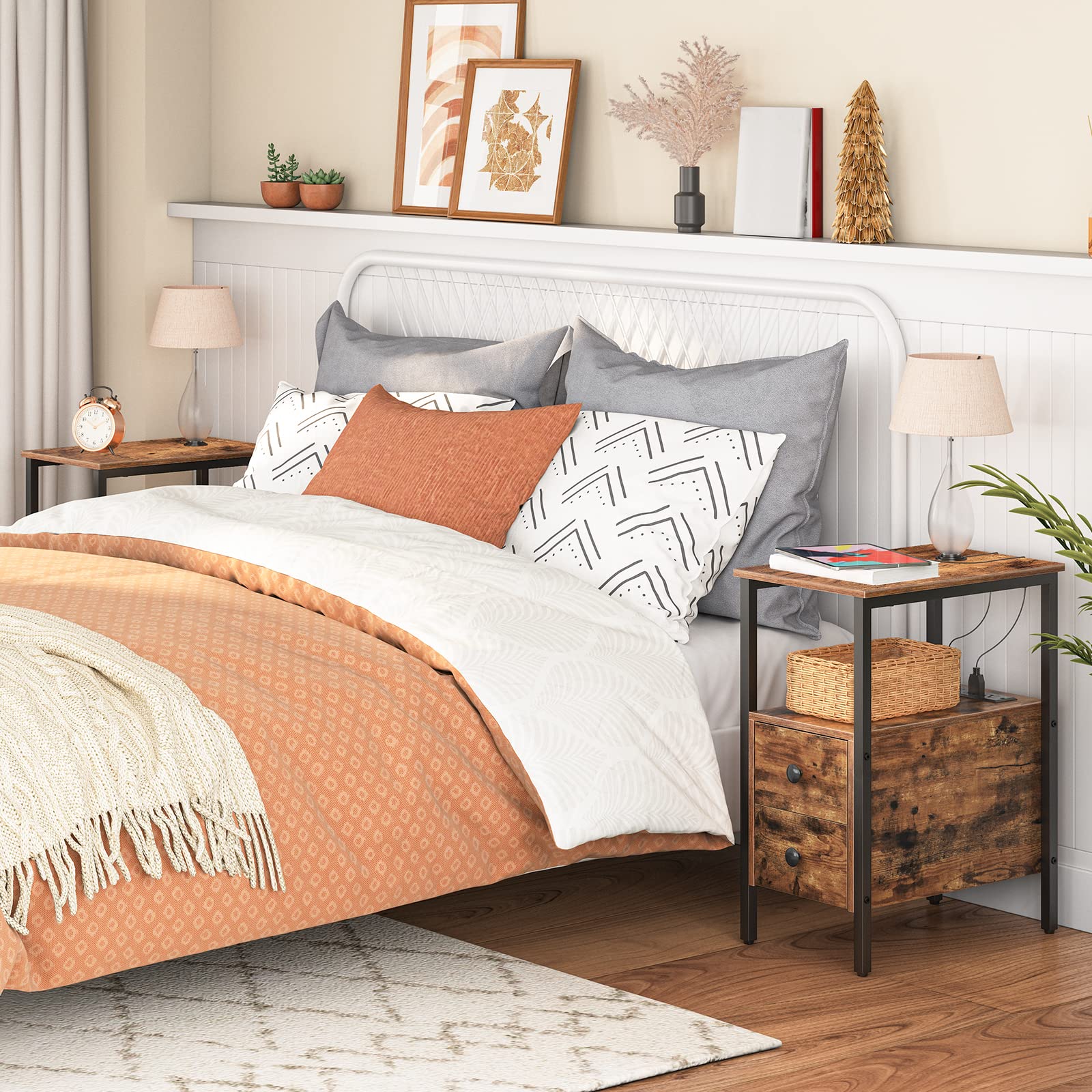 Bedroom with a bed featuring orange and gray bedding, nightstands, and decorative items.