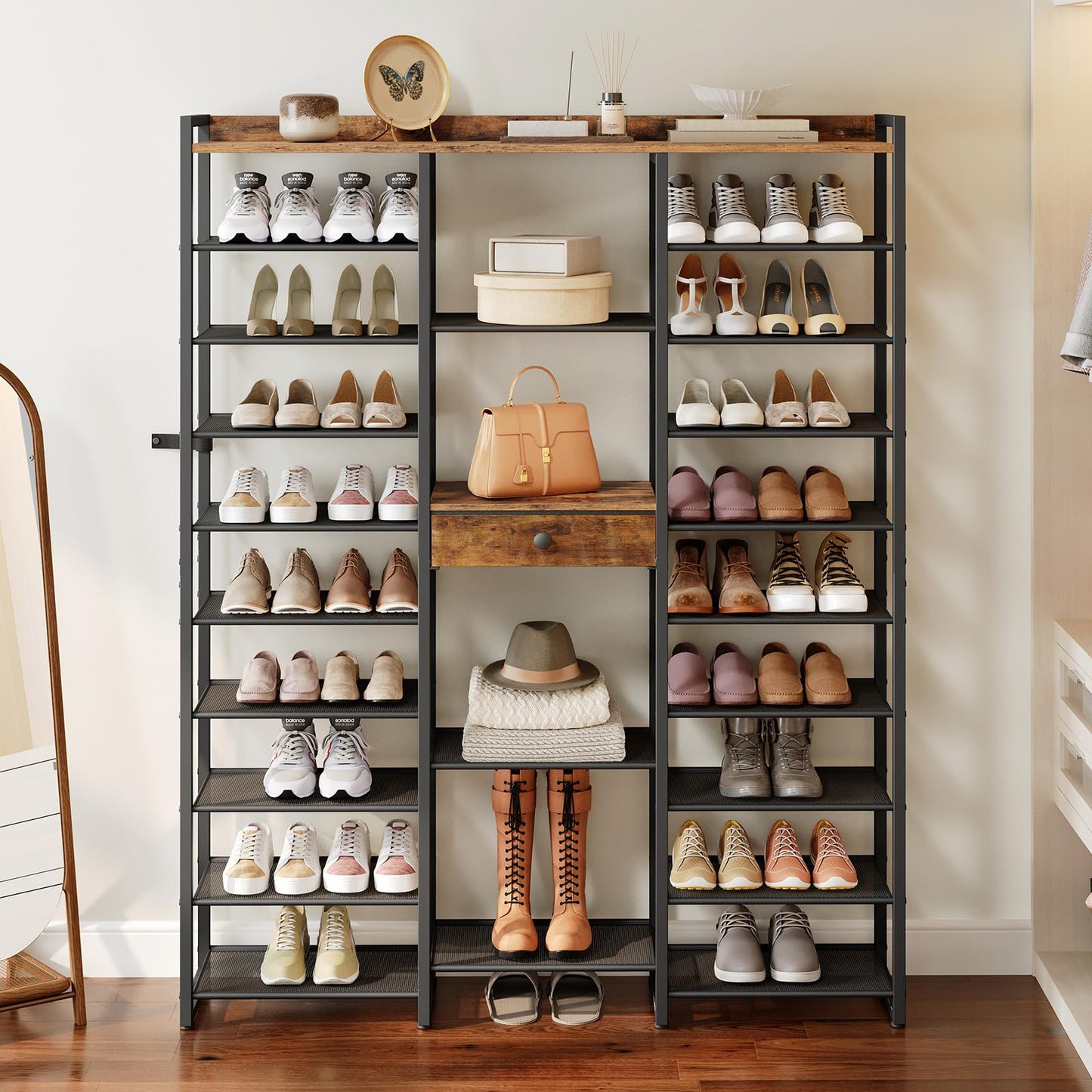 Shoe rack with various shoes and a handbag on wooden shelves.