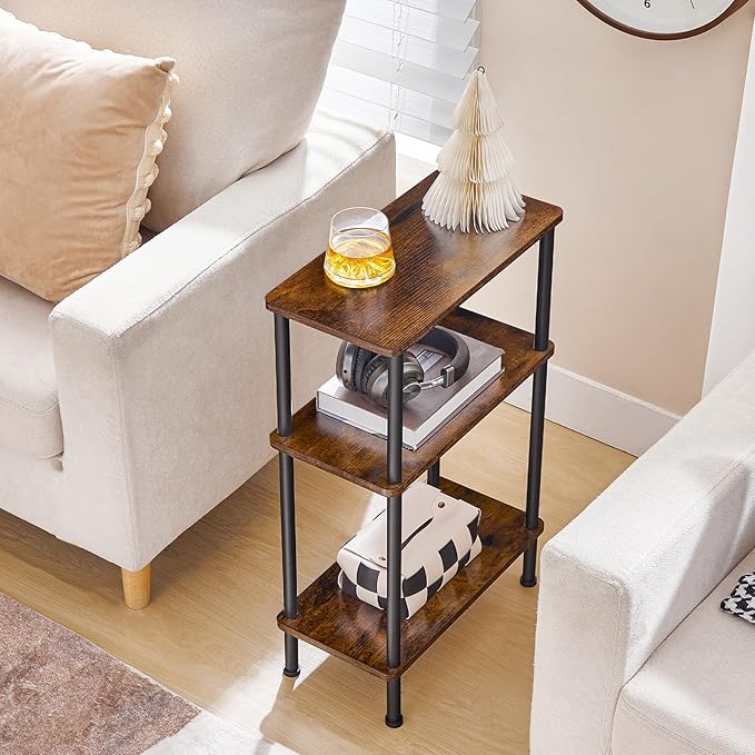 Three-tier side table with a glass of beer and books in a living room setting.