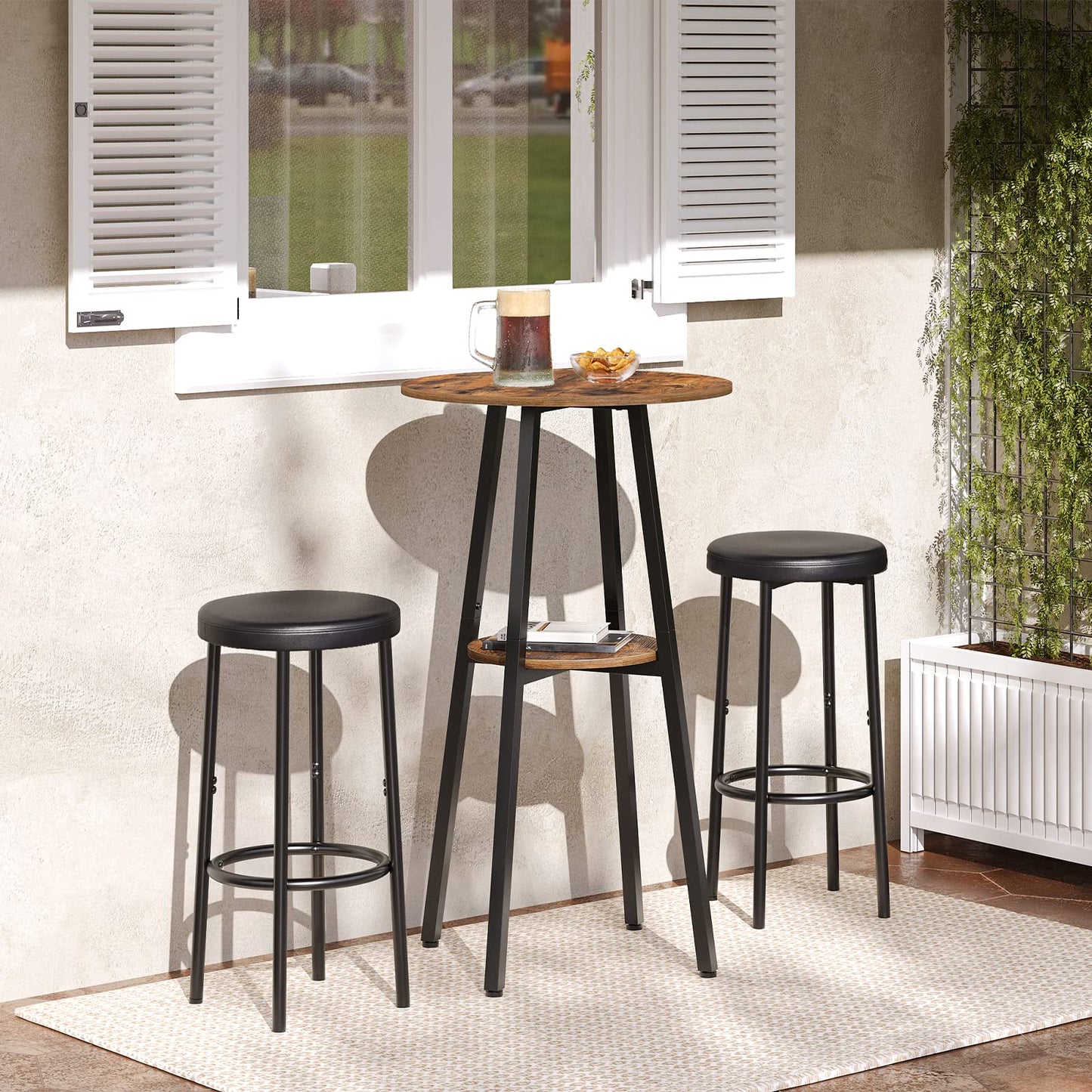 High table with stools in a room with a window and plant