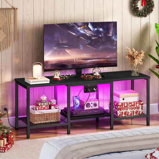 Black TV stand with colorful LED lighting in a living room setting.