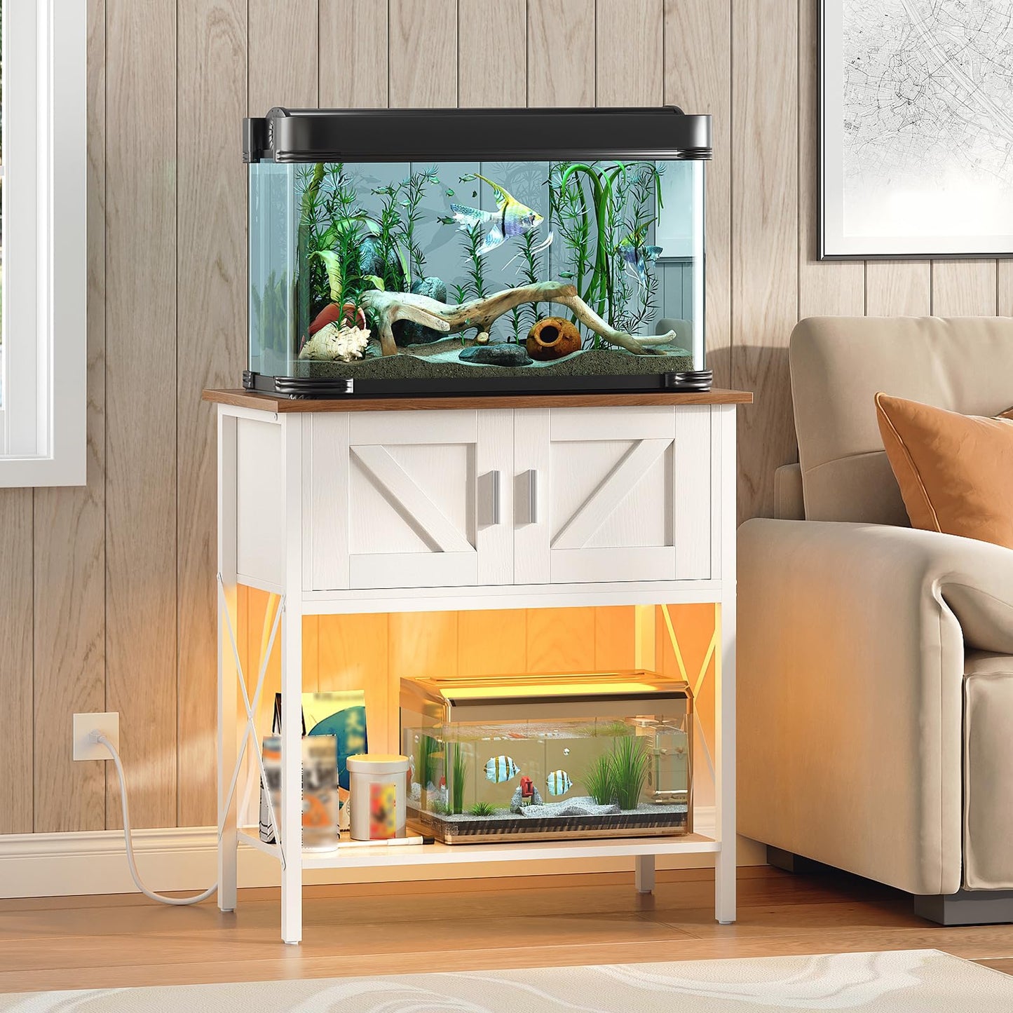 Fish tank on a stand in a living room setting with a couch and wall decor.