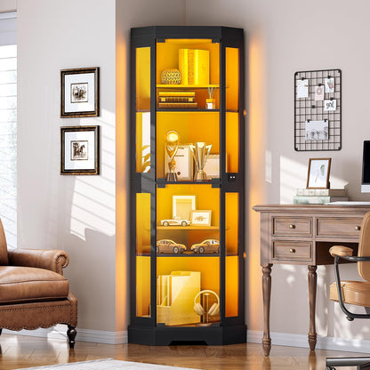 Tall glass display cabinet with yellow interior lighting in a room with a desk and chair.