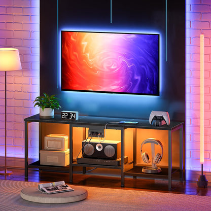 Modern living room with a TV, shelves, and decorative items against a brick wall.