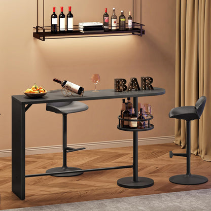 Bar setup with a table, stools, and wine bottles against a beige wall.