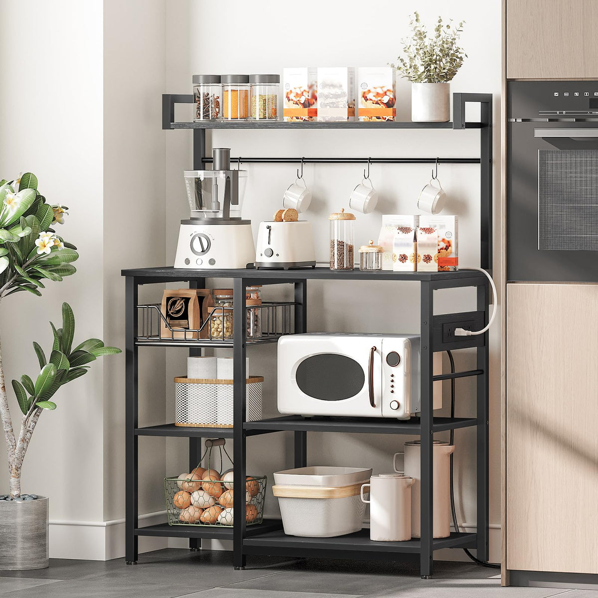 HOOBRO Bakers Rack with Power Outlet, 35.4 Inches Coffee Bar with Mesh Basket, Microwave Stand with 4 S-Shaped Hooks, Kitchen Bakers Rack with Storage, Easy to Assemble, Black BB05HB01