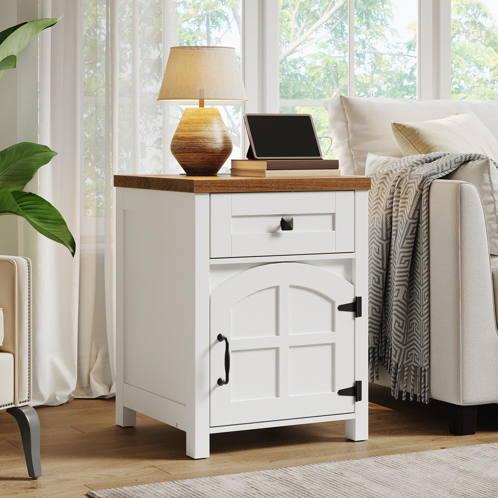 White nightstand with wooden top in a living room setting