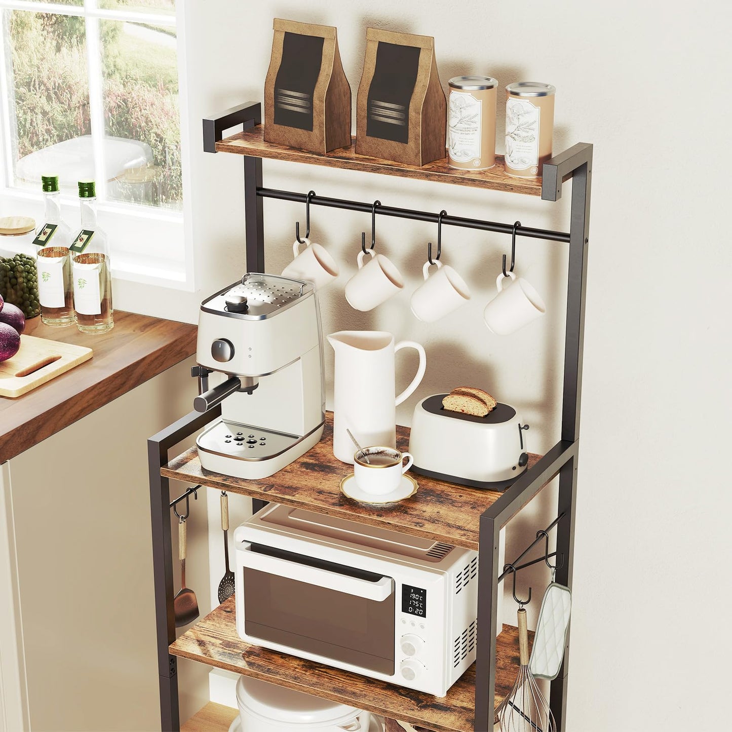 Small kitchenette with a wooden shelf holding a coffee machine, mugs, and other kitchen items.