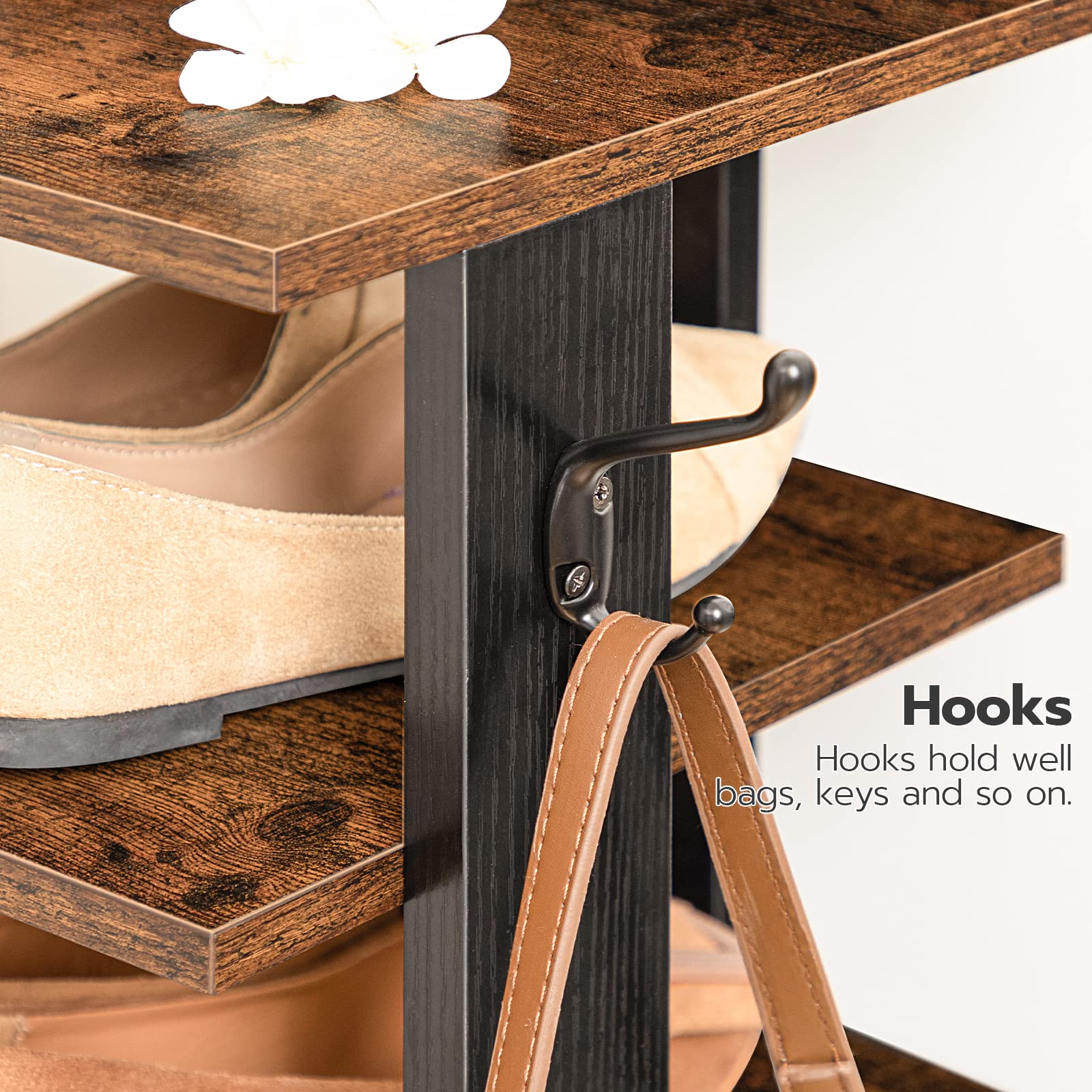 Wooden shoe rack with hooks holding shoes and a strap.