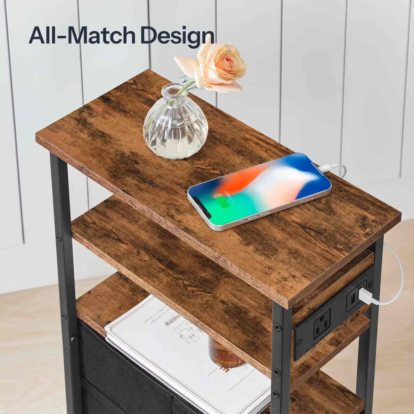 Wooden side table with a smartphone, notebook, and vase on a white background