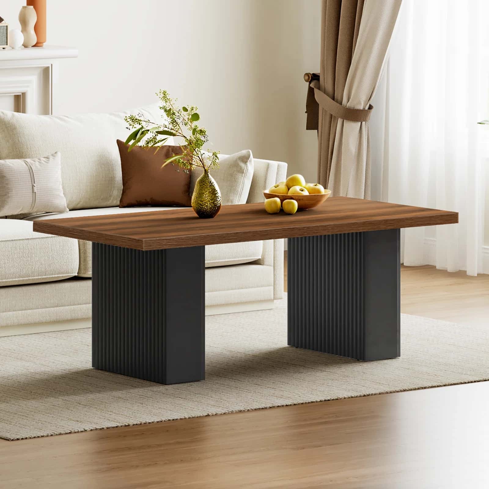 Wooden coffee table with black legs in a living room setting