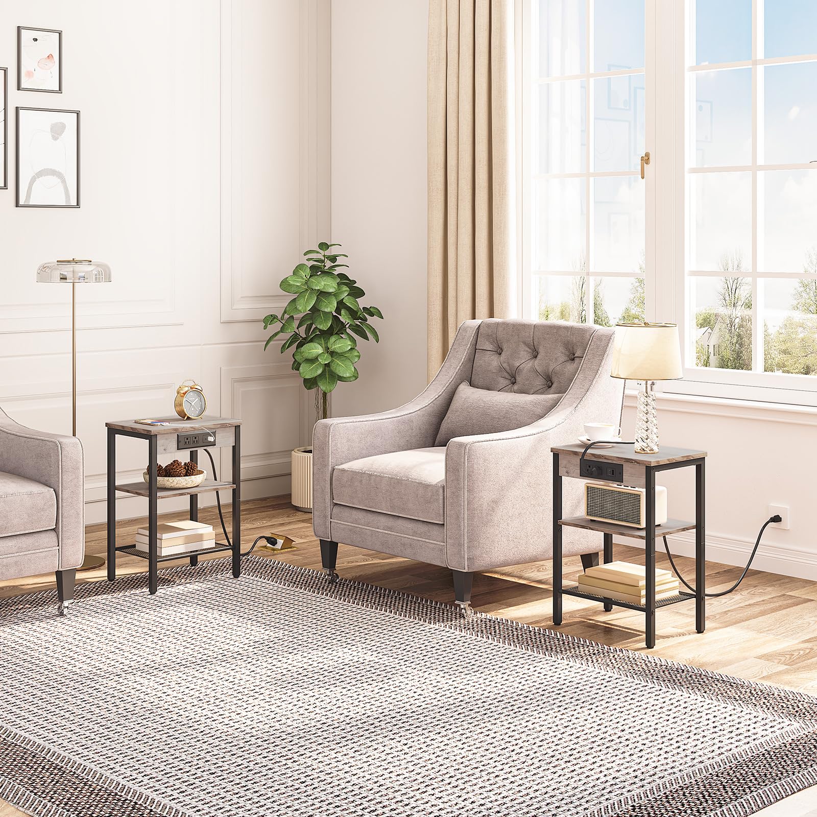 Living room with gray armchair, side tables, and a large window.