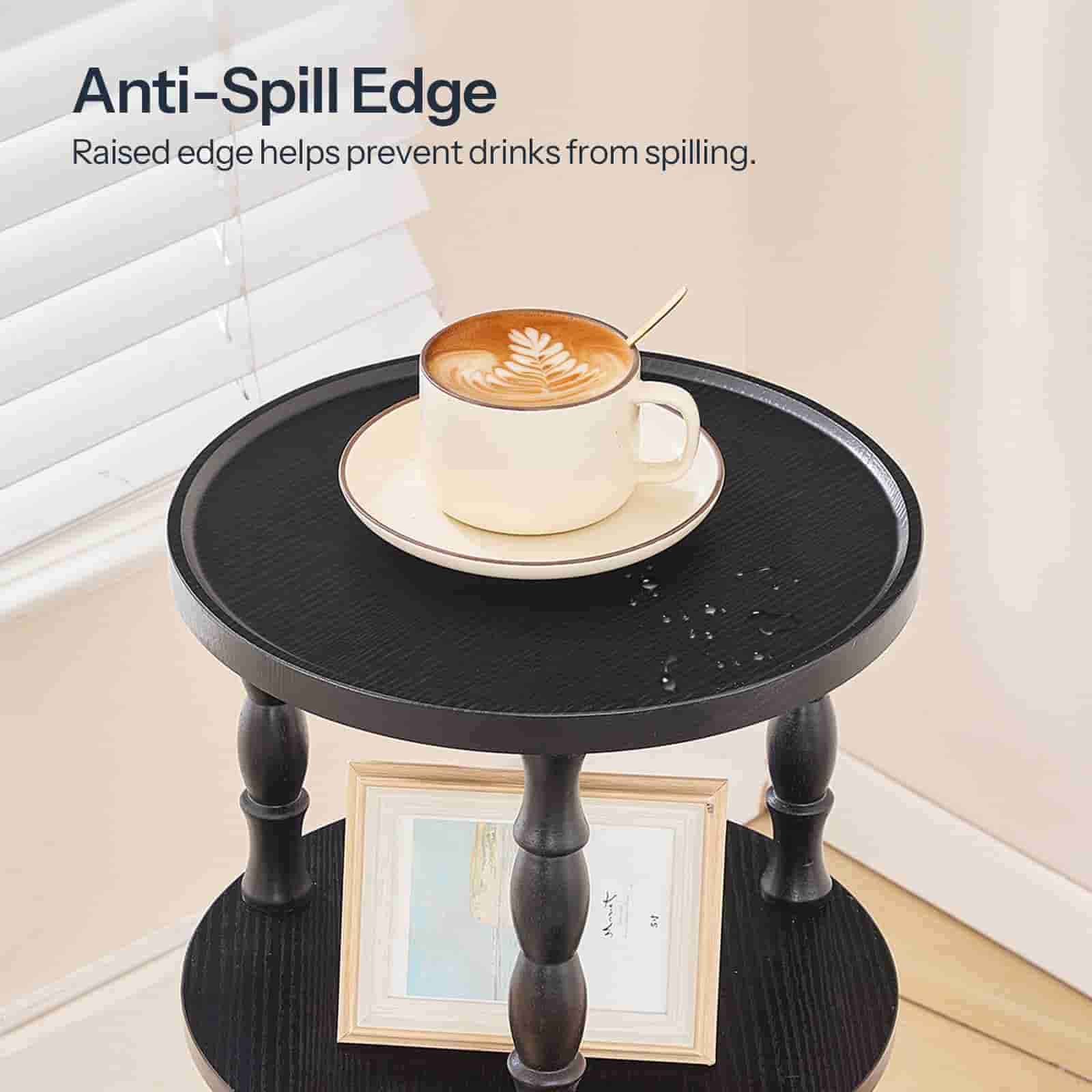 Small round table with anti-spill edge feature, displaying a cup of coffee.