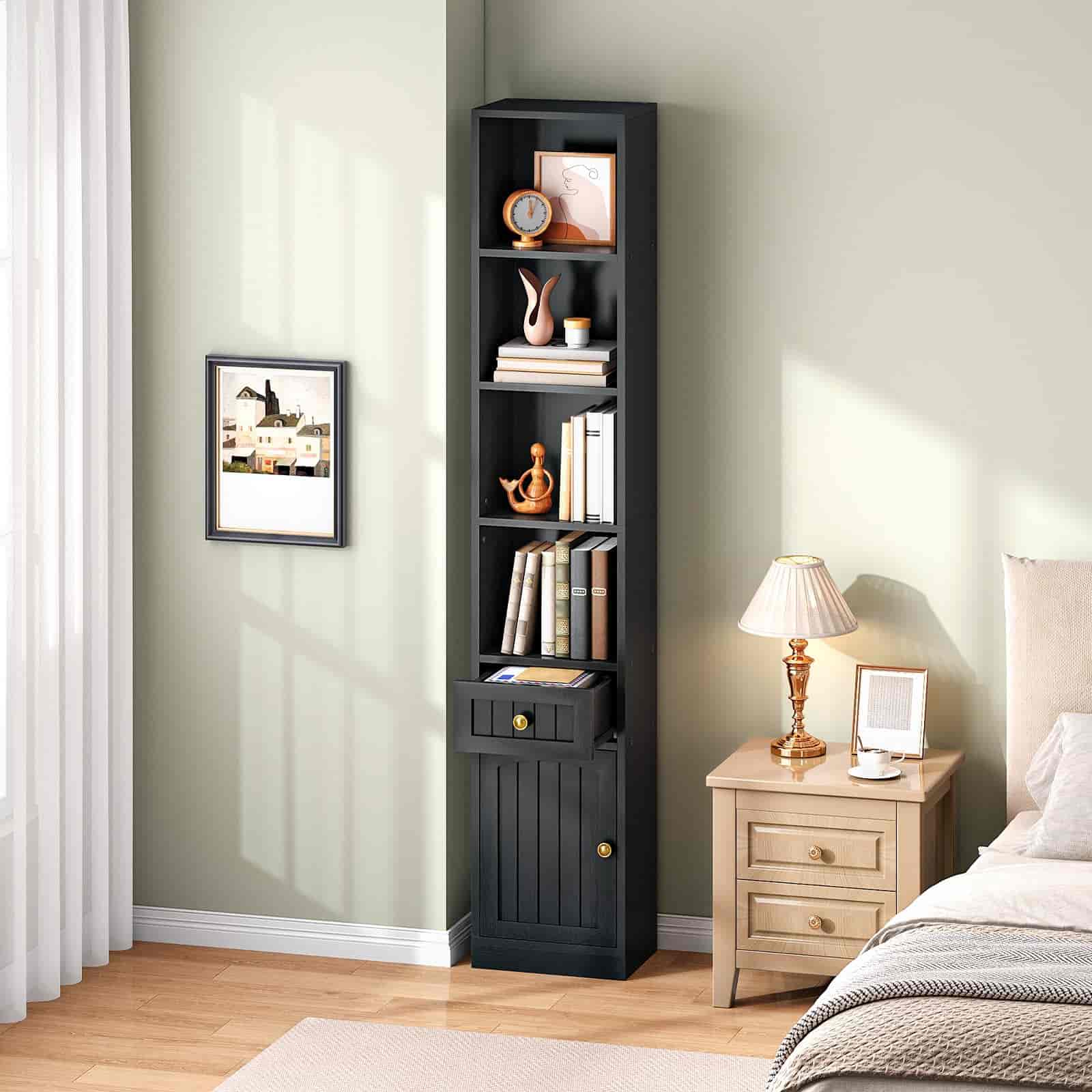 Tall black bookshelf in a bedroom with a lamp and decor items.