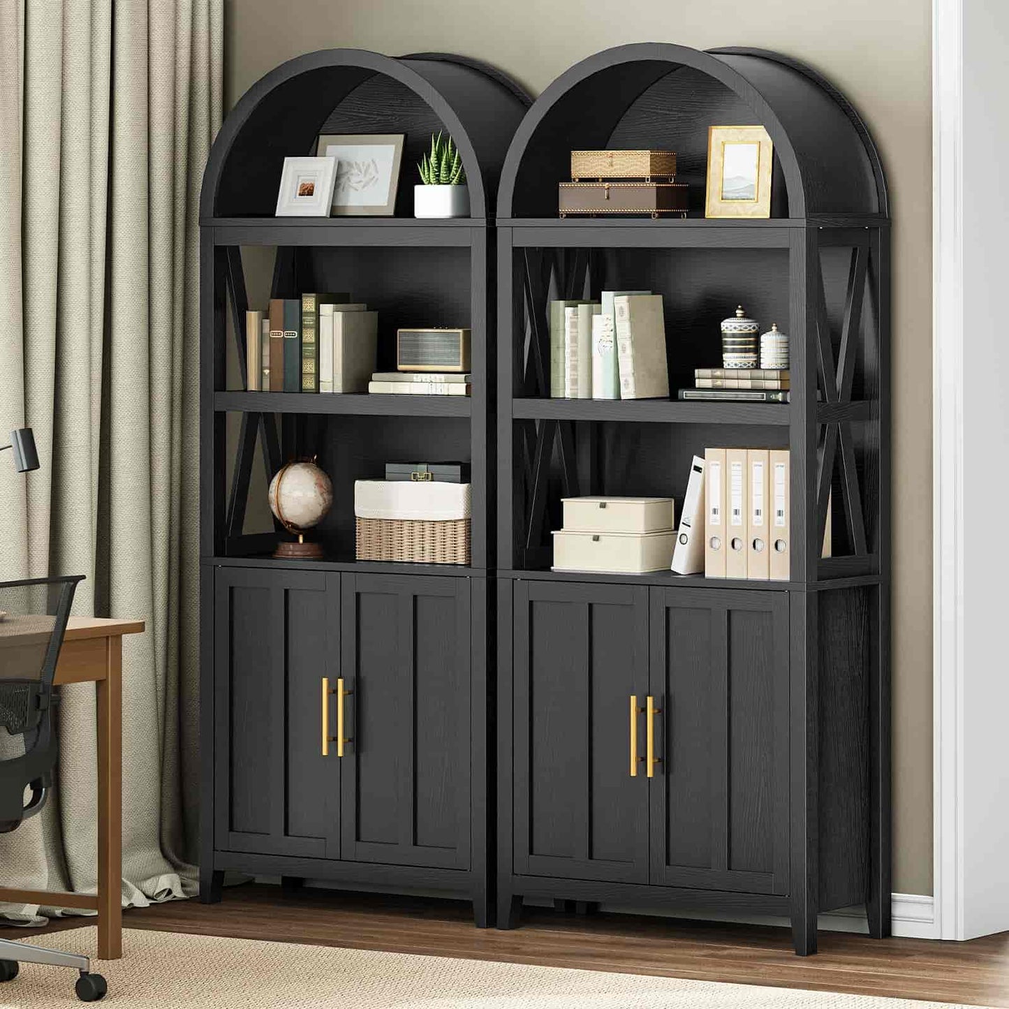 Pair of dark wooden bookshelves with decorative items in a room setting.