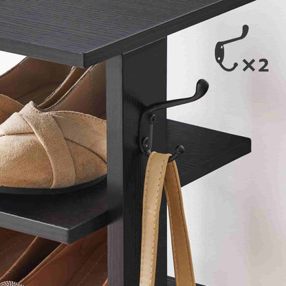Black shoe rack with shoes and a belt, featuring two hooks on a white background.