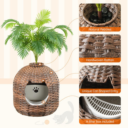 Wicker cat litter box with plant, natural pebbles, and handwoven rattan design.