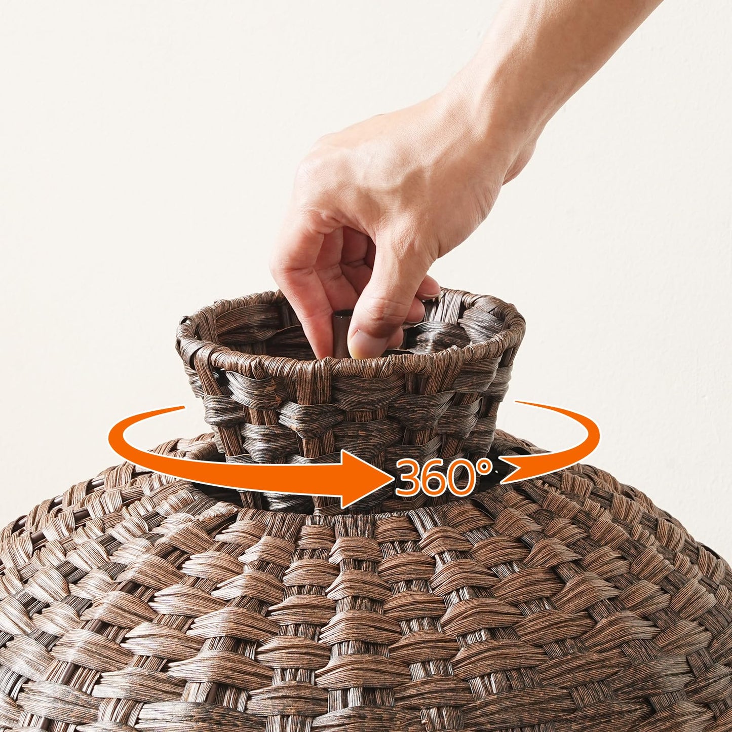 Hand interacting with a woven basket, emphasizing its 360-degree design.