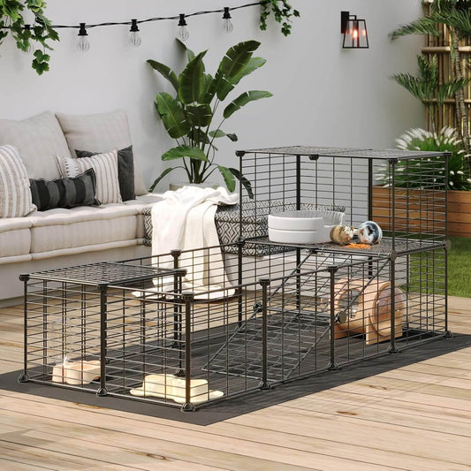 Large metal pet cage on a wooden deck with plants and a sofa in the background