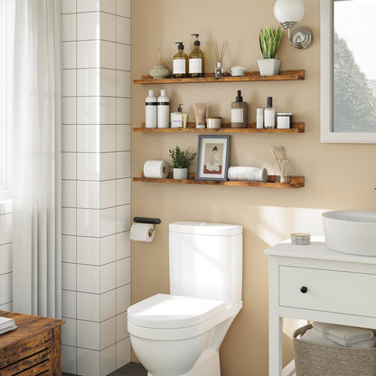 Bathroom with white toilet, wooden shelves with toiletries, and a sink.