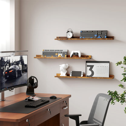 Modern home office setup with desk, chair, computer monitor, and shelves.