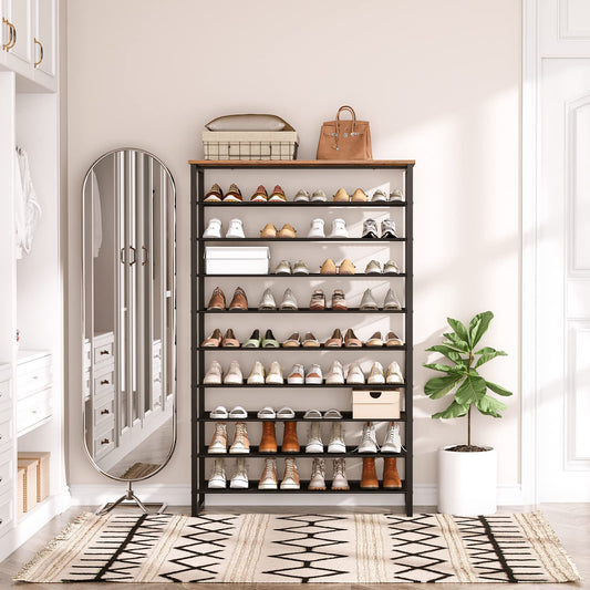 Shoe rack with various shoes in a room with a mirror and plant