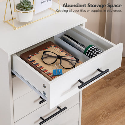 Open drawer of a white desk with office supplies on a wooden floor.