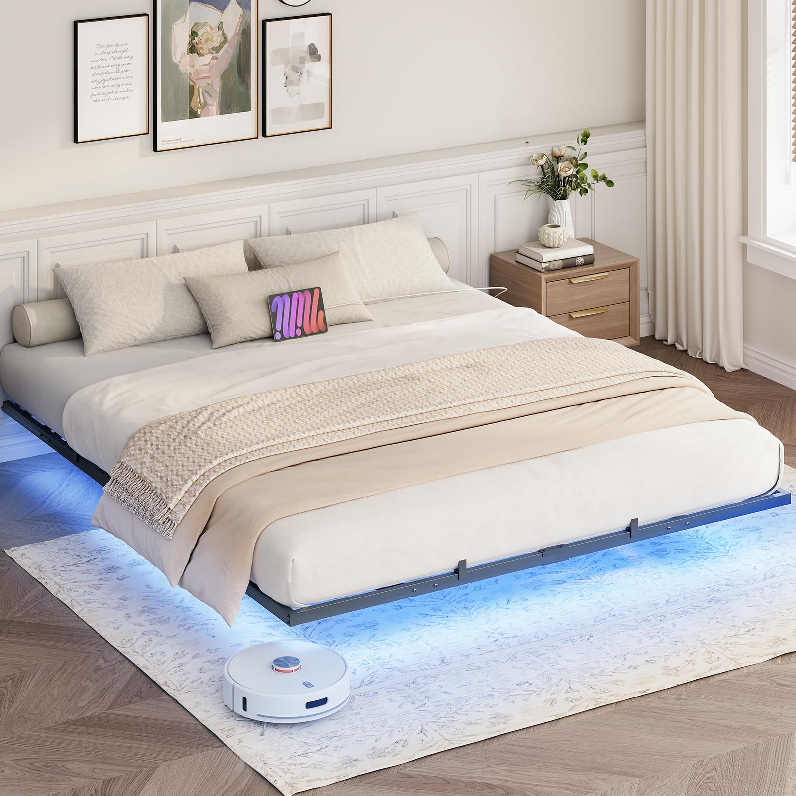Robotic vacuum cleaner on a bed with LED lighting underneath