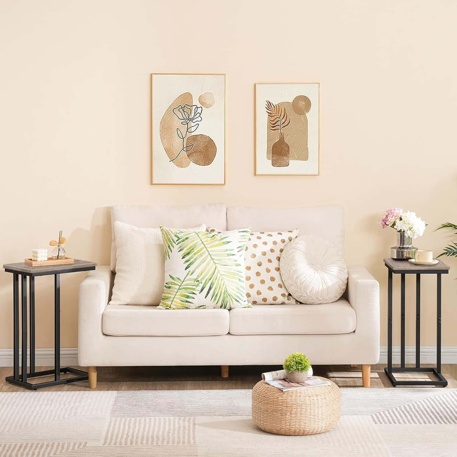 Living room with a beige sofa, decorative pillows, and wall art.