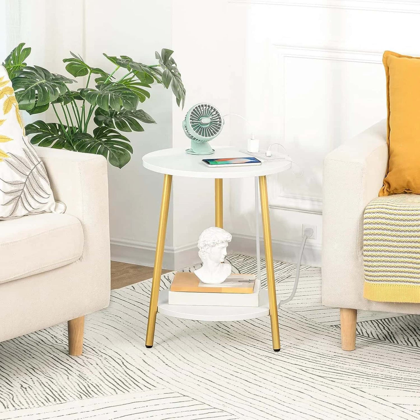 Modern living room with a side table, chairs, and decorative items.