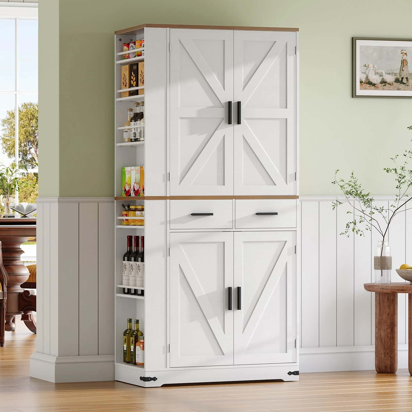 White pantry cabinet with barn door design in a kitchen setting