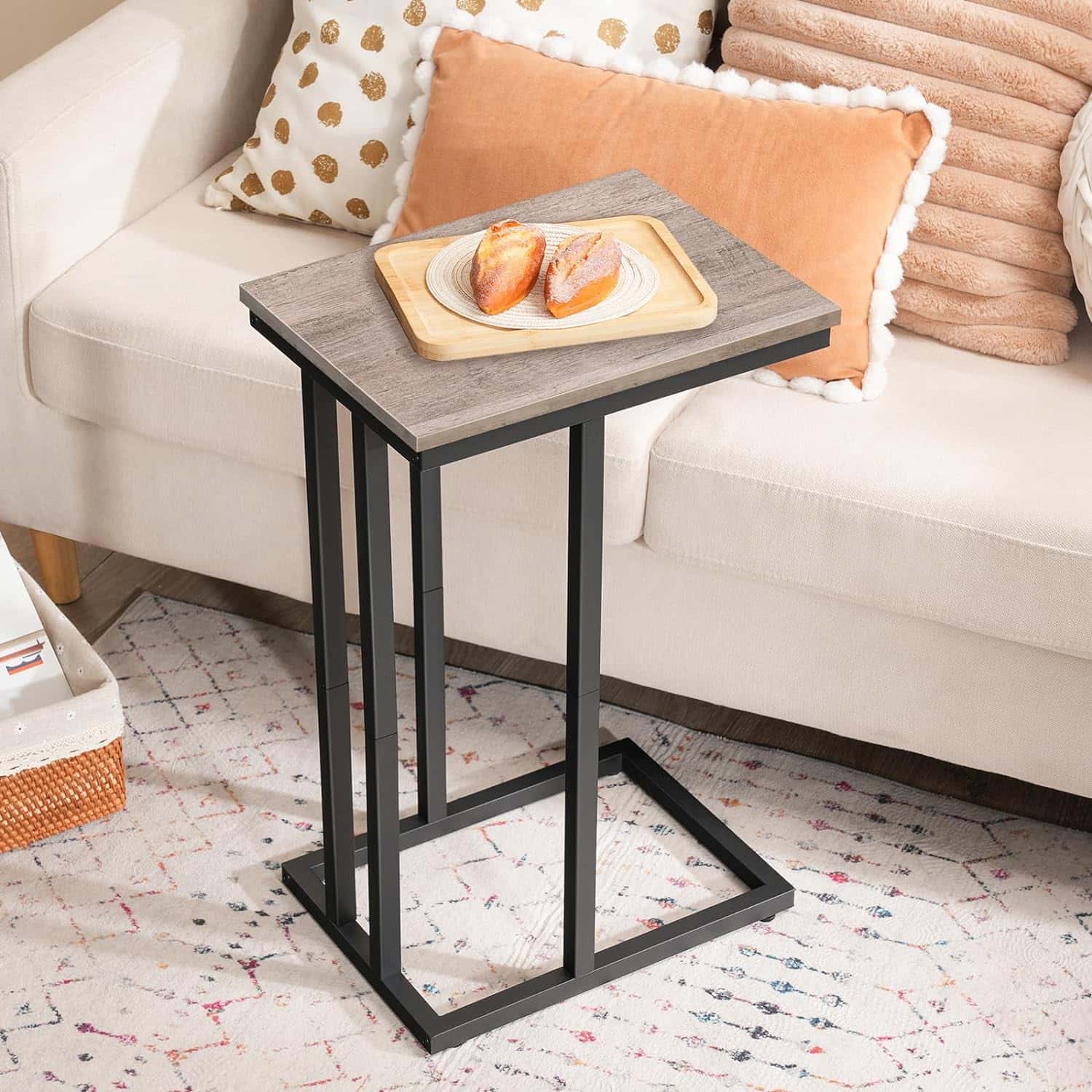 Small side table with a plate of food on a sofa