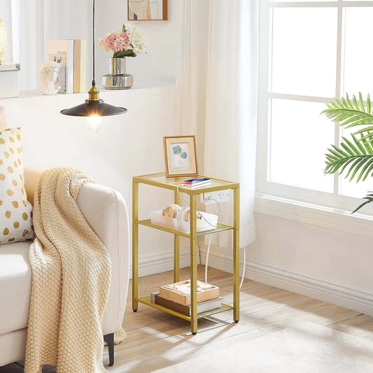 Gold side table in a living room with decor items