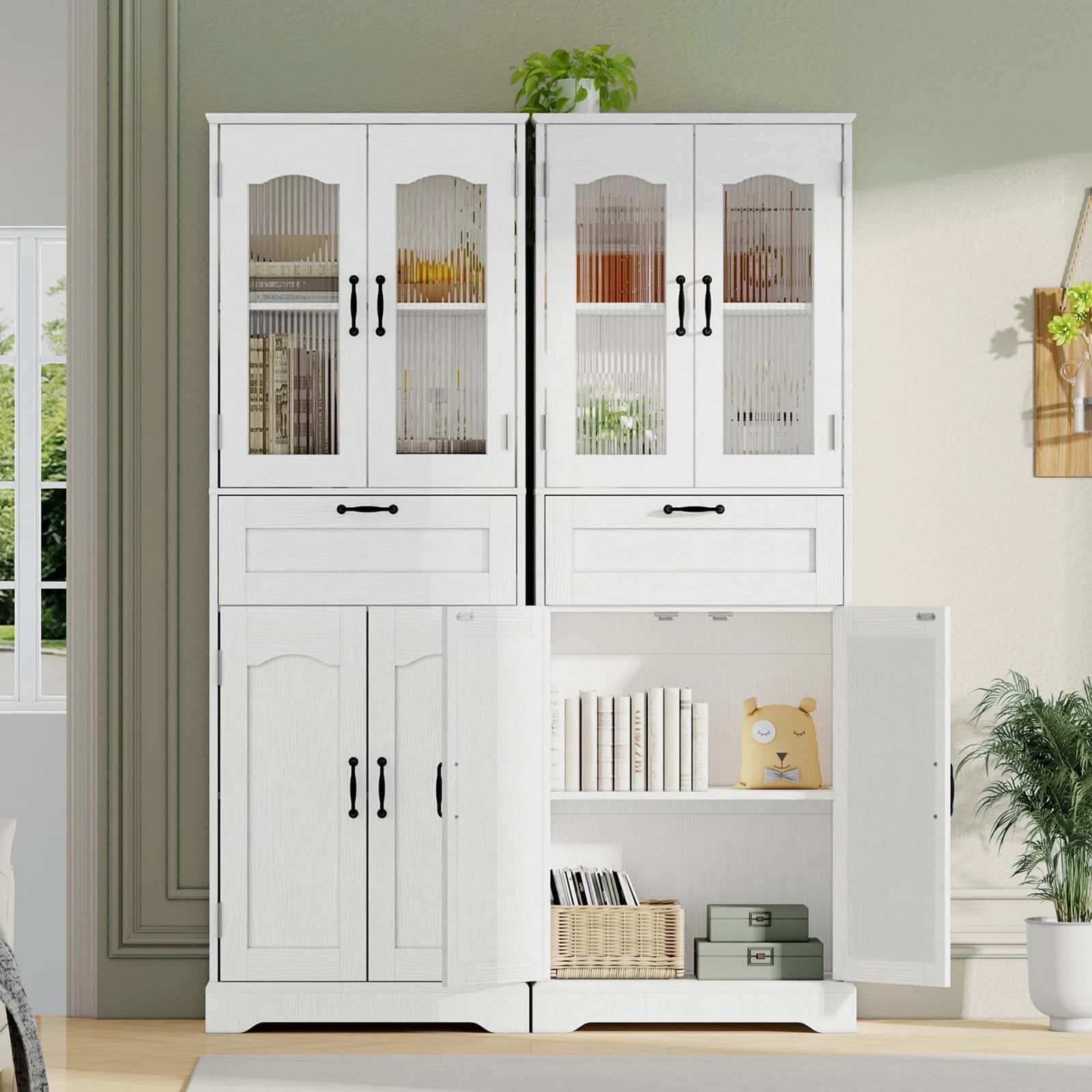 White storage cabinet with glass doors in a room setting