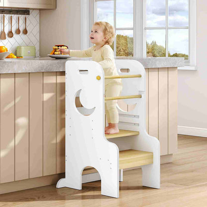 Child using a step stool in a kitchen